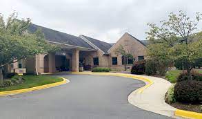 This is an external photograph of Autumn Lake Healthcare at Oak Manor in Burtonsville, Maryland. 